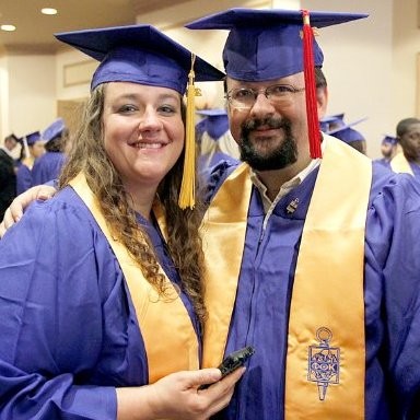 Erin Luper, cybersecurity expert at LuperIQ, at graduation alongside her husband Dave Luper II